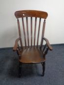 A mahogany rail back kitchen armchair