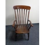 A mahogany rail back kitchen armchair