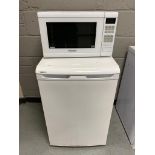 A Beko under bench freezer together with a Panasonic Inverter microwave.