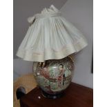 A bulbous Japanese style table lamp with shade depicting geishas.