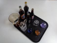 A tray of four glass paperweights to include Caithness, cut glass and silver plated claret jug,