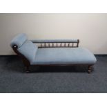 An antique mahogany framed chaise longue upholstered in blue dralon