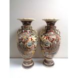 A pair of Japanese Satsuma vases, height 57 cm.