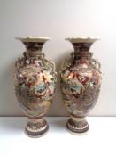 A pair of Japanese Satsuma vases, height 57 cm.