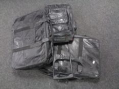 A box containing three 20th century black leather luggage cases.