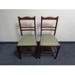 A pair of Edwardian inlaid mahogany bedroom chairs