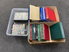 Two boxes and a crate containing a large quantity of first day covers and world stamps in albums.