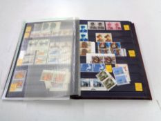 An album of stamps - GB commemorative single mint sets,