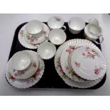 A tray containing 21 pieces of antique pink rose patterned tea china.