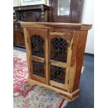 A sheesham wood double door corner cabinet