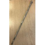 An antique glass charm cane or medicine rod,