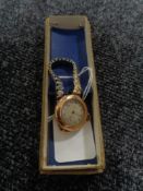 An antique 9ct gold Elgin wristwatch, on later expansion strap.