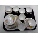 A tray containing 21 pieces of Windsor floral patterned bone tea china.