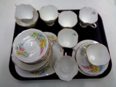 A tray containing 21 pieces of Windsor floral patterned bone tea china.