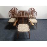 An oak gateleg table and a set of five Windsor chairs comprising one carver and four singles