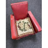 An early 20th century red vinyl upholstered child's armchair