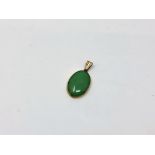 A 9ct yellow gold mounted jade pendant