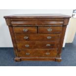 An Edwardian stained pine six drawer chest