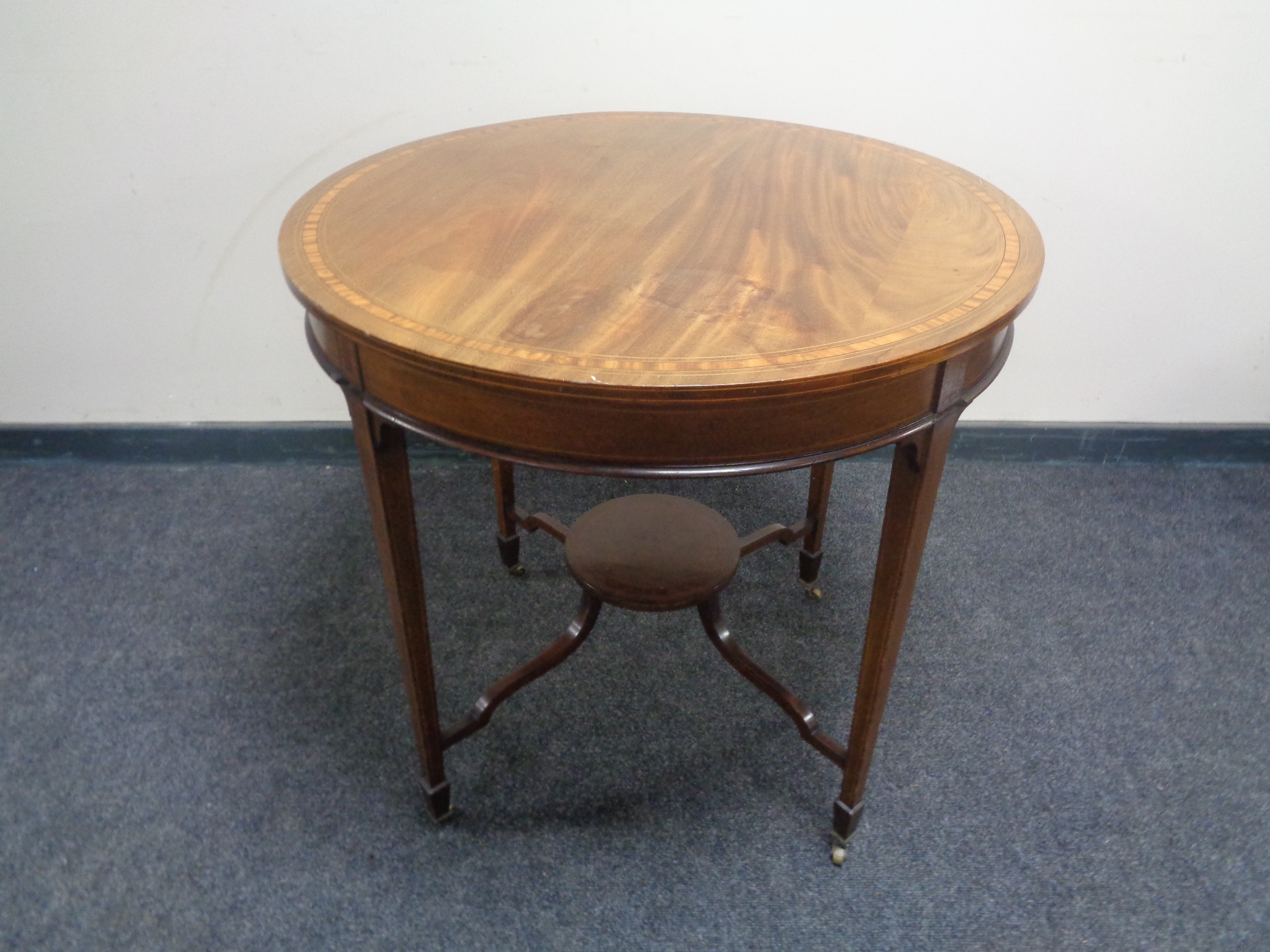 A 19th century circular mahogany occasional table with satinwood inlay