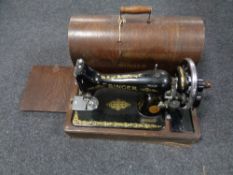 A vintage Singer cased sewing machine.