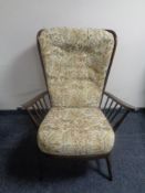 An Ercol elm and beech armchair