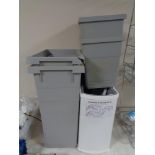 A quantity of assorted bins together with a wire metal kitchen cabinet storage rack and wine rack.