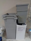 A quantity of assorted bins together with a wire metal kitchen cabinet storage rack and wine rack.