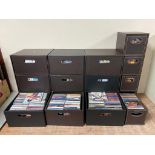 Four brown faux leather storage chests containing a large quantity of assorted CDs together with