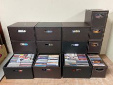 Four brown faux leather storage chests containing a large quantity of assorted CDs together with