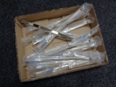 A box containing 12 stainless steel kitchen cabinet door handles (new).