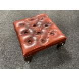 A button leather Chesterfield stool on Queen Anne legs.