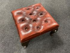 A button leather Chesterfield stool on Queen Anne legs.