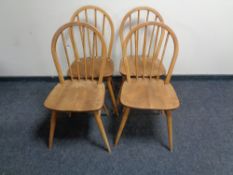 A set of four Ercol elm spindle back chairs