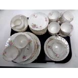 A tray containing 40 pieces of antique Worcester rose patterned tea china.