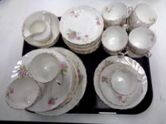 A tray containing 40 pieces of antique Worcester rose patterned tea china.