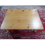 A stripped pine low coffee table