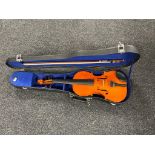 A Chinese violin and bow in case.