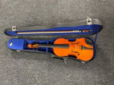 A Chinese violin and bow in case.