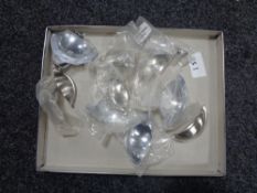 A box containing 15 stainless steel kitchen cabinet door handles (new).