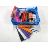 A crate of Prinz strips, Stanley Gibbons albums etc.