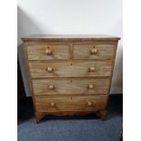 A Victorian mahogany five drawer chest.