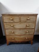 A Victorian mahogany five drawer chest.