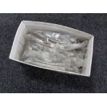A box containing 26 stainless steel kitchen cabinet door handles (new).