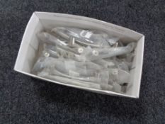 A box containing 26 stainless steel kitchen cabinet door handles (new).