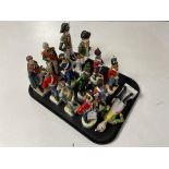 A tray of thirteen continental figures of soldiers in 19th century dress