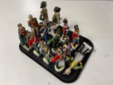 A tray of thirteen continental figures of soldiers in 19th century dress