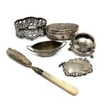 A collection of silver items including Rum label,