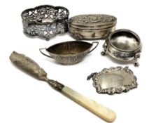 A collection of silver items including Rum label,