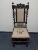 An antique oak barley twist hall chair upholstered in a tapestry fabric