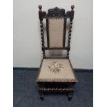 An antique oak barley twist hall chair upholstered in a tapestry fabric